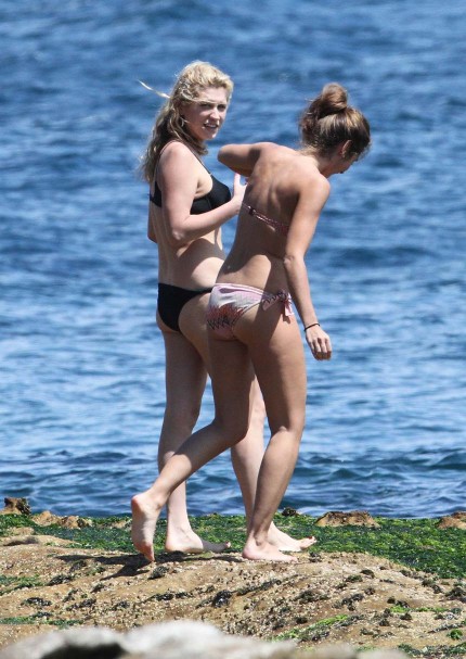 Kesha aka Ke ha sports a black bikini while hanging out on the beach at